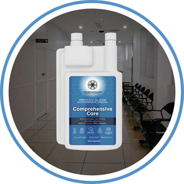 Large container of 'Comprehensive Core' supplement in a room with chairs and a door.