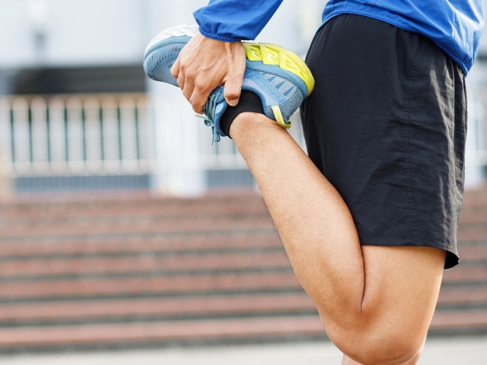man stretchng leg